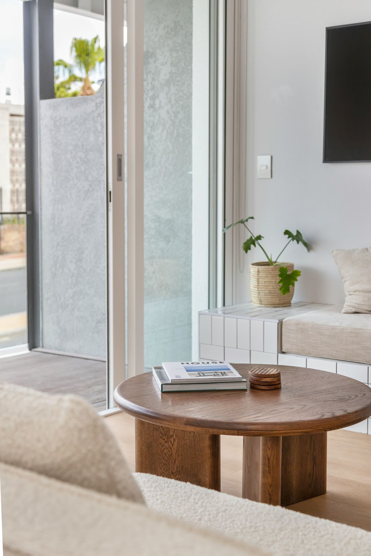 a living room with a couch a table and a tv